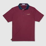 A short-sleeve polo shirt in garnet with a charcoal collar and a small embroidered logo on the left chest, displayed flat against a light gray background.
