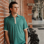 USF Bulls Fairway Floral four-button polo in green and gold floral pattern