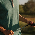 USF Bulls Fairway Floral four-button polo in green and gold floral pattern