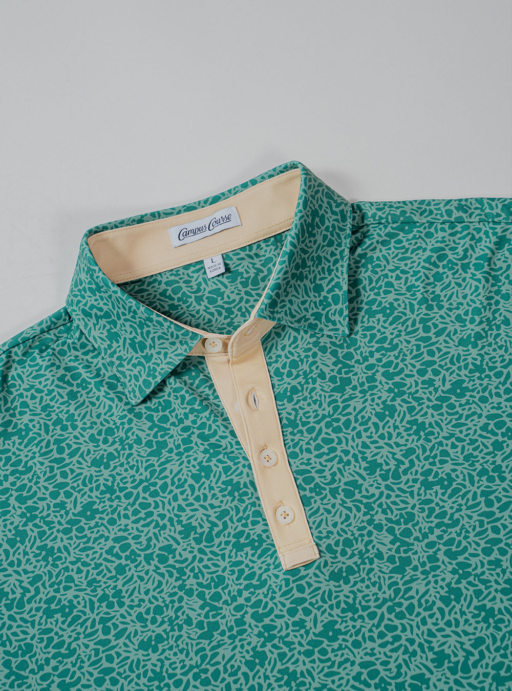 USF Bulls Fairway Floral four-button polo in green and gold floral pattern