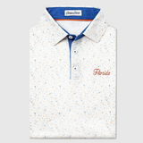 White UF polo shirt with multicolor speckles and 'Florida' text on a light gray background