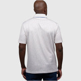 Man wearing a white UF polo shirt with a subtle pattern on a white background